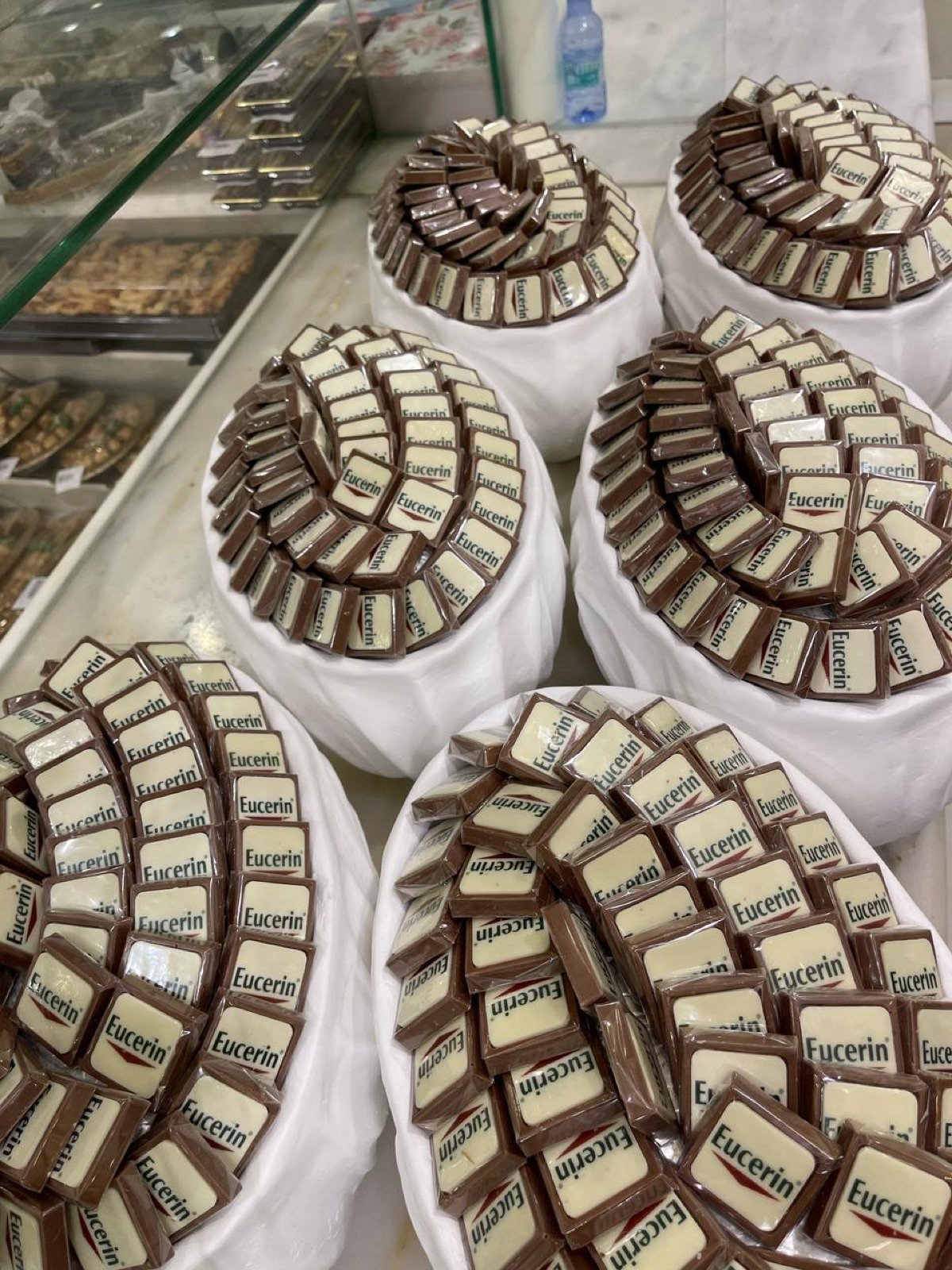 Displays of Eucerin-branded chocolates arranged in spirals