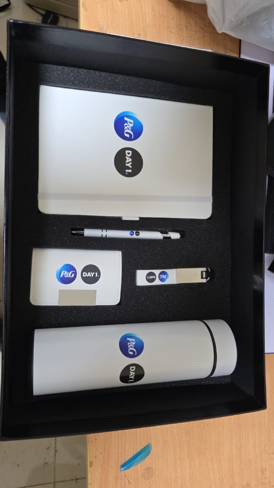 Inside of the P&G welcome box with branded items